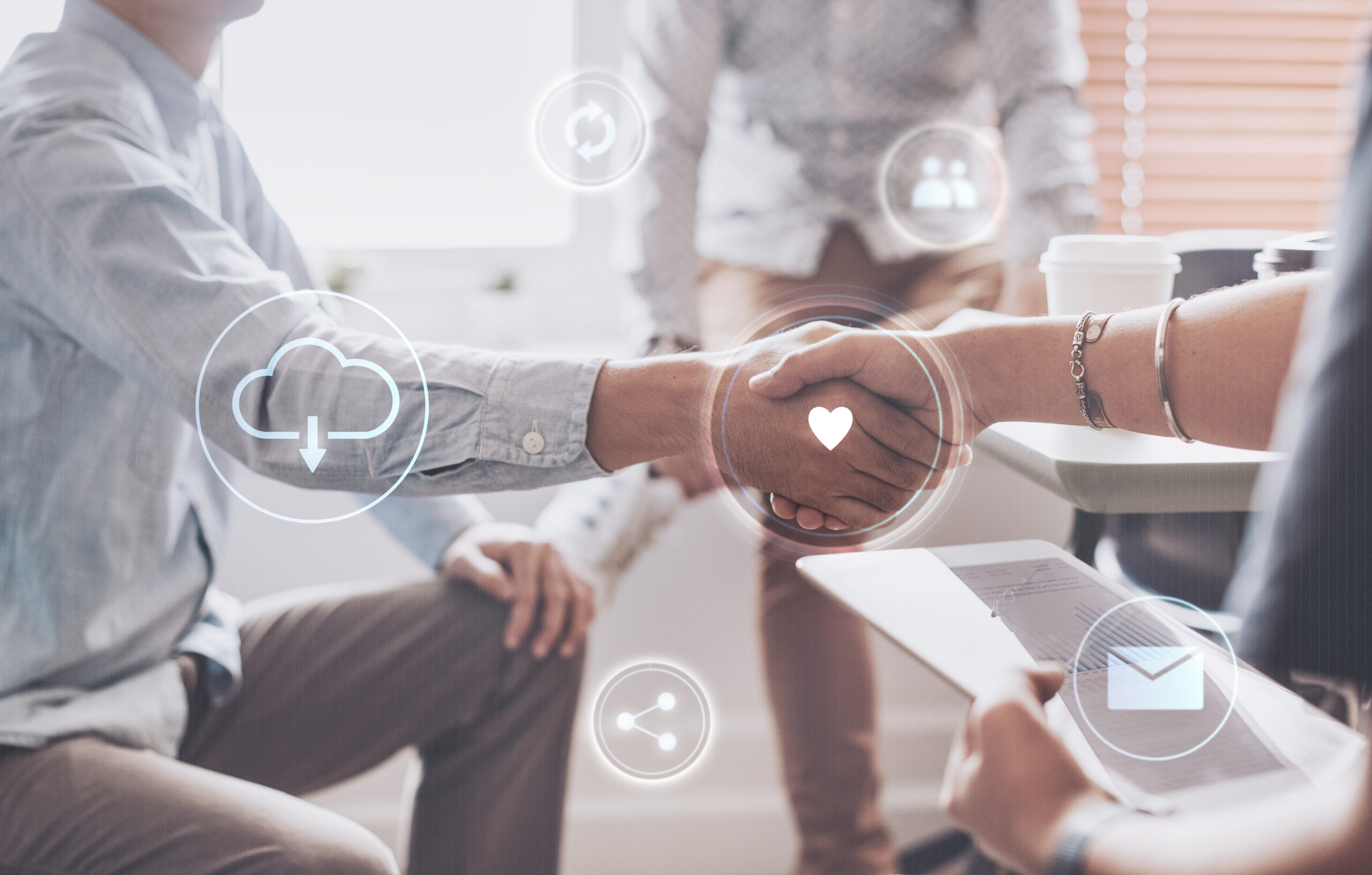 Business professionals shaking hands, symbolizing how to automate employee onboarding with digital workflows.