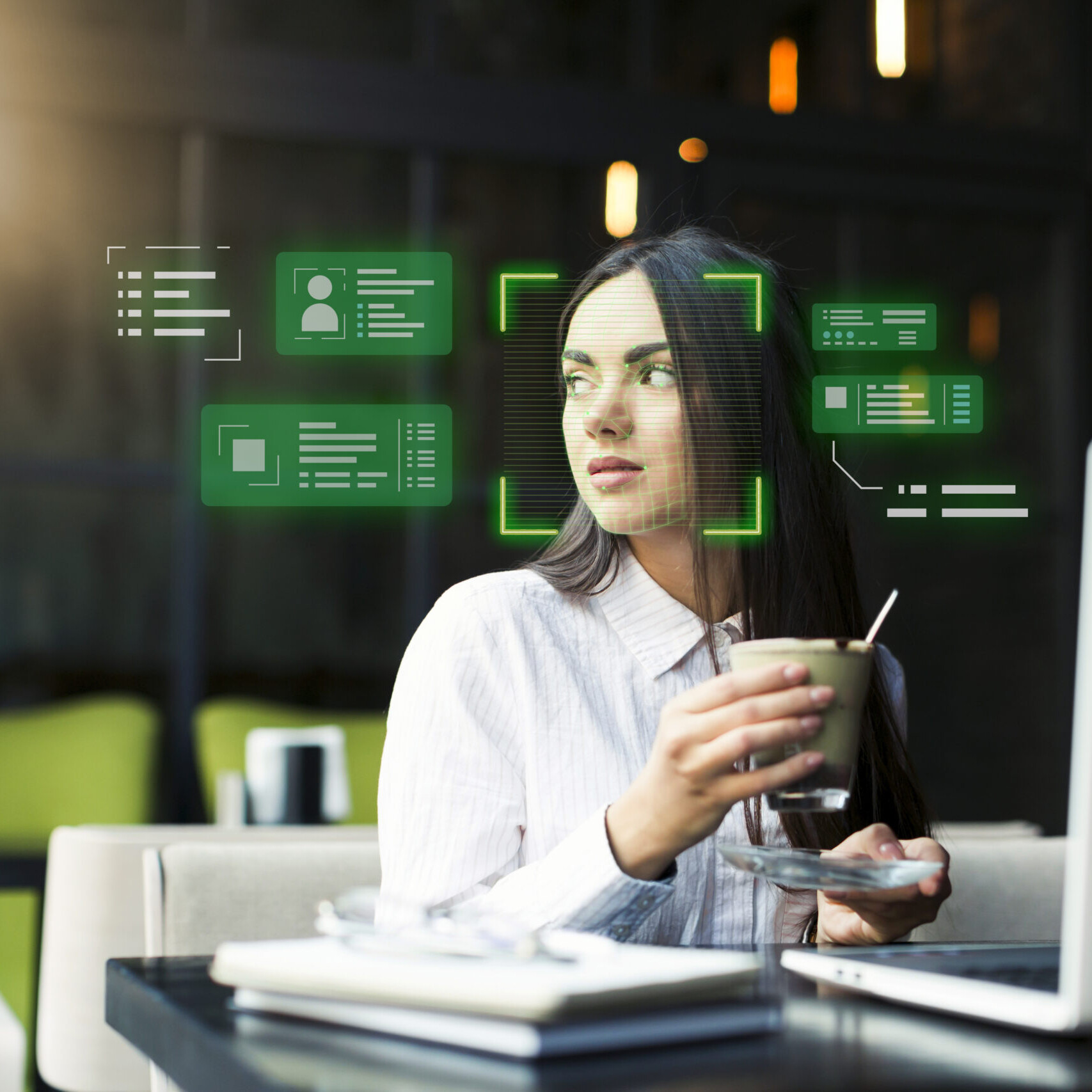 Businesswoman working on a laptop with core HR software interface displaying employee data
